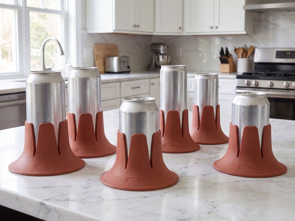 Six cans of different diameters, from a slim can to a stovepipe, each standing in a terracotta Steadi base.